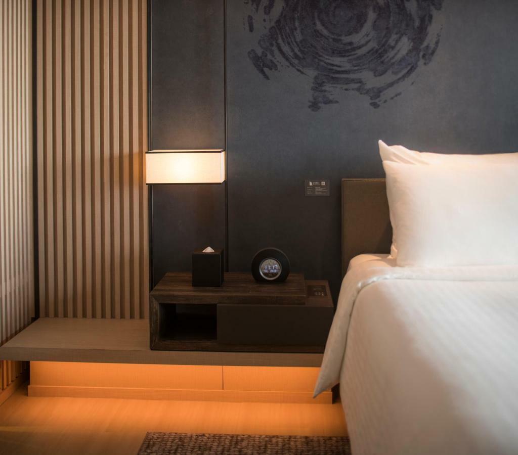 Mu Jiaoxi Hotel Zewnętrze zdjęcie A room at the hotel