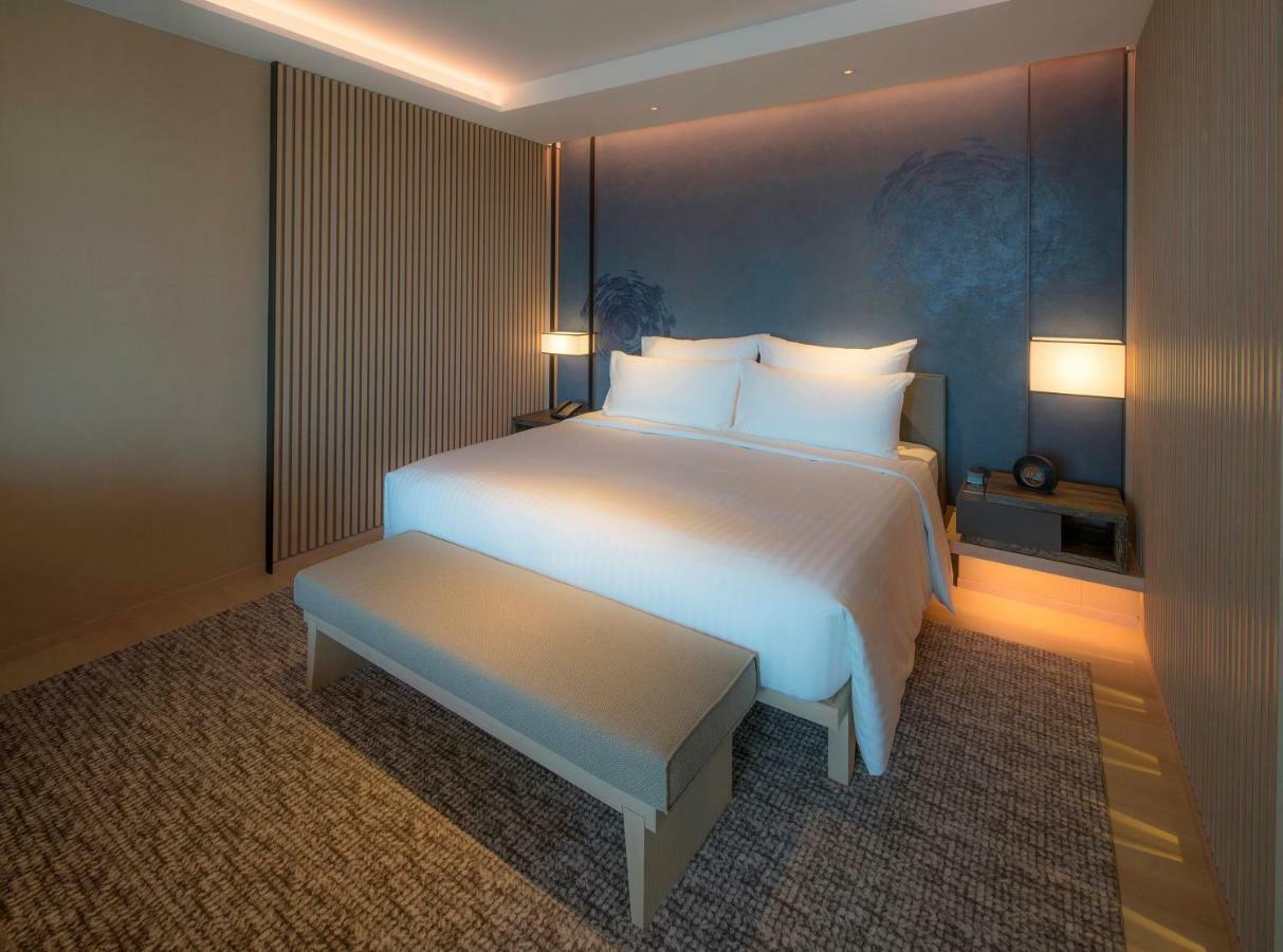 Mu Jiaoxi Hotel Zewnętrze zdjęcie A bedroom at the hotel
